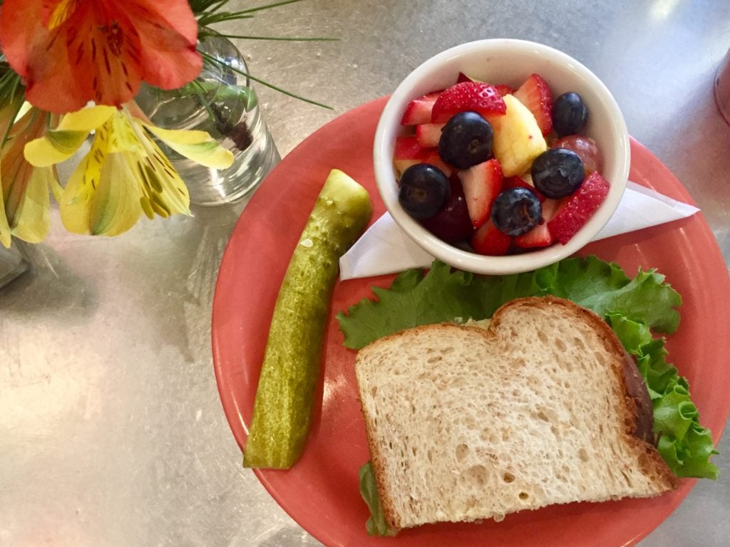 Egg Salad Sandwich with fresh fruit at Queenies in Tulsa