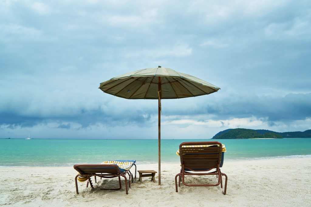 Beach chairs and umbrella - beach packing tips