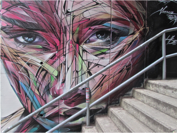 "Multi-coloured Woman's Face" by Hopare in Hong Kong