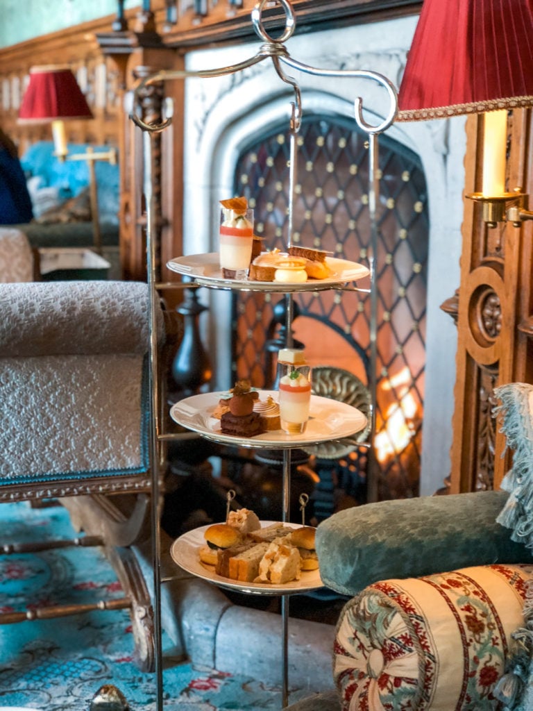 A three tiered tray filled with small food items at Ashford Castle afternoon tea