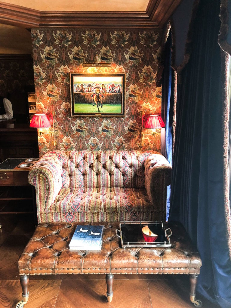 A decorative couch inside the billiards room at Ashford Castle