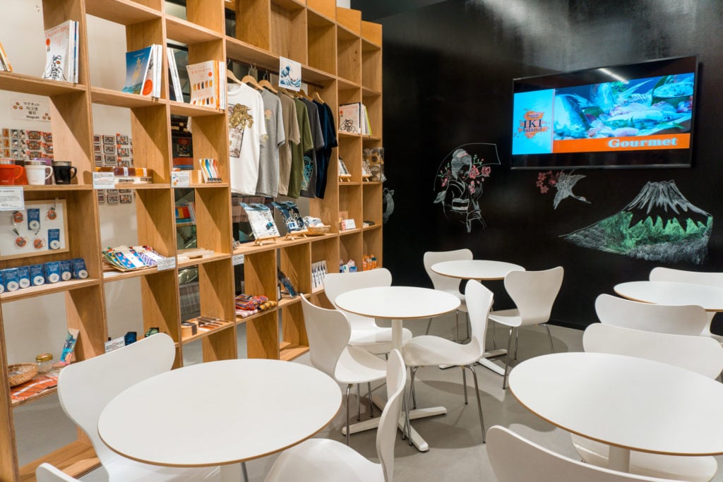 Seating area with displays of travel memorabilia