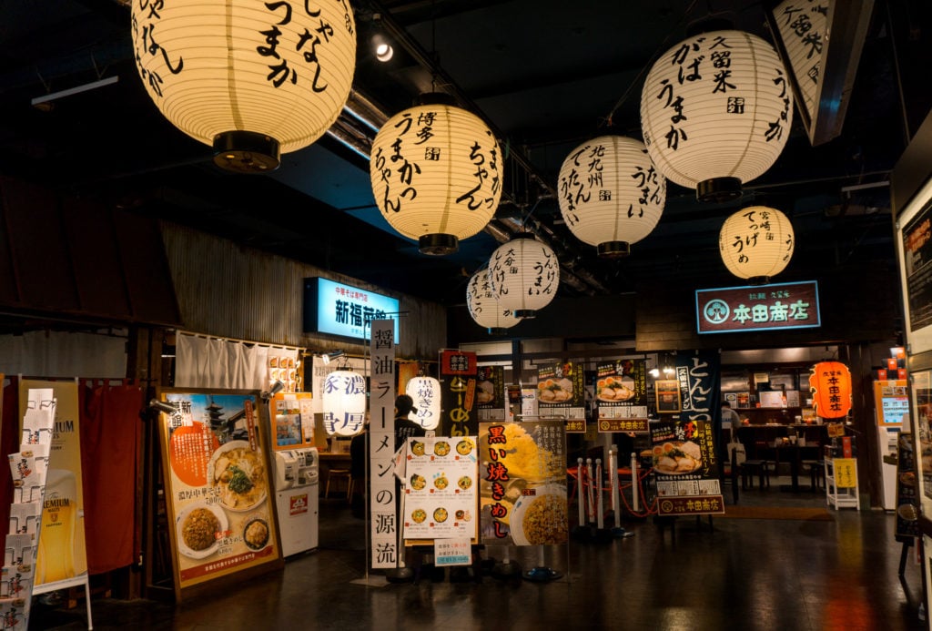 Japanese lanterns hanging from the ceiling by a few Japanese ramen restaurants in Canal City Hakata - Fukuoka, Japan