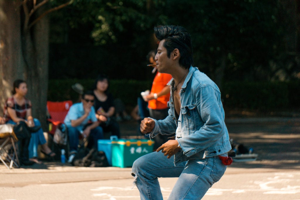 Man dressed in denim dancing (rockabilly dancers Tokyo)