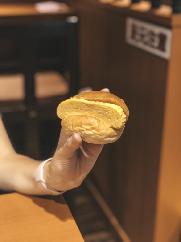 A sweet bun with rolled egg omelet at Nishiki Market