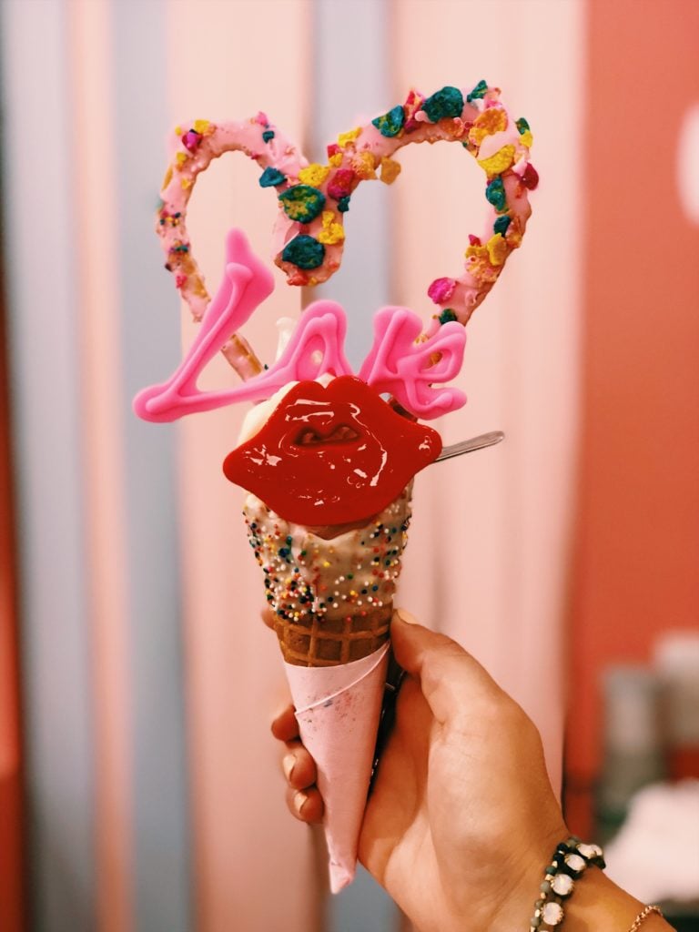 Hand holding ice cream cone from Eddy's Ice Cream in Tokyo