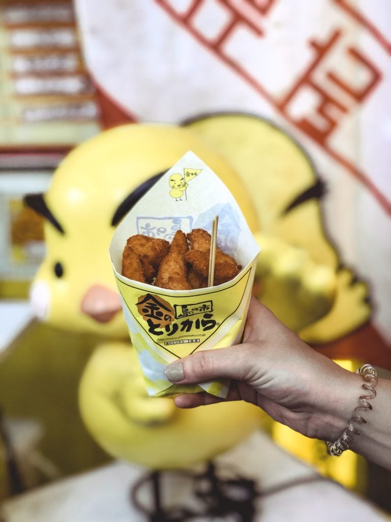 Pieces of fried chicken Dotonbori street food in Osaka Japan