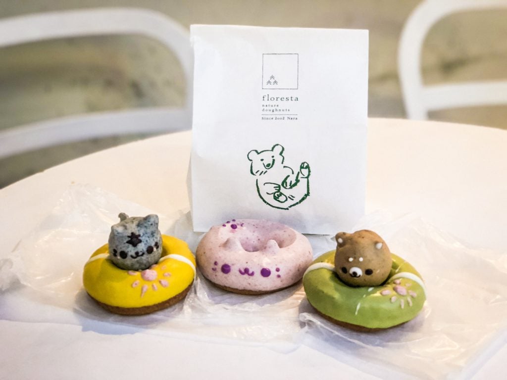 Three donuts shaped to look like animals (cat and bear).