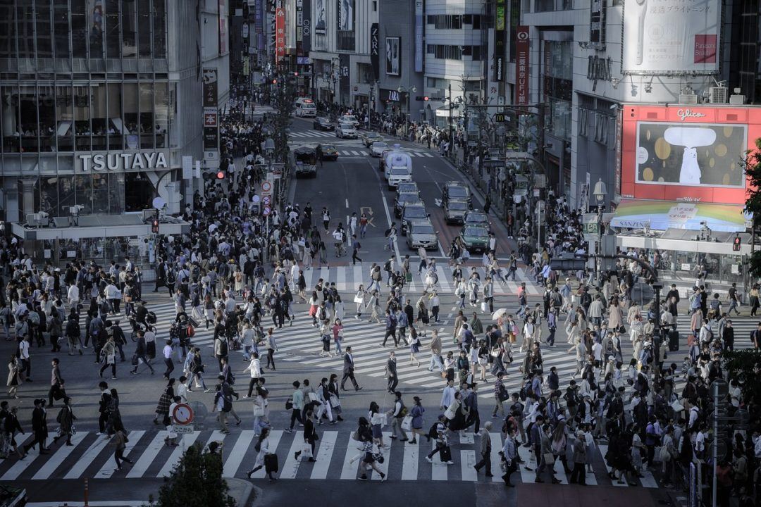 A large number of people walking on a crosswalk (Shibuya Pedestrian crossing in Tokyo, Japan)