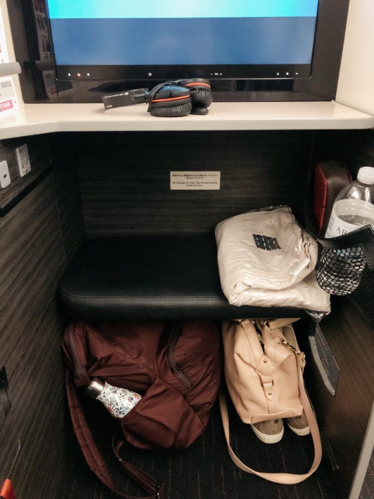 Japan Airlines business class seat storage