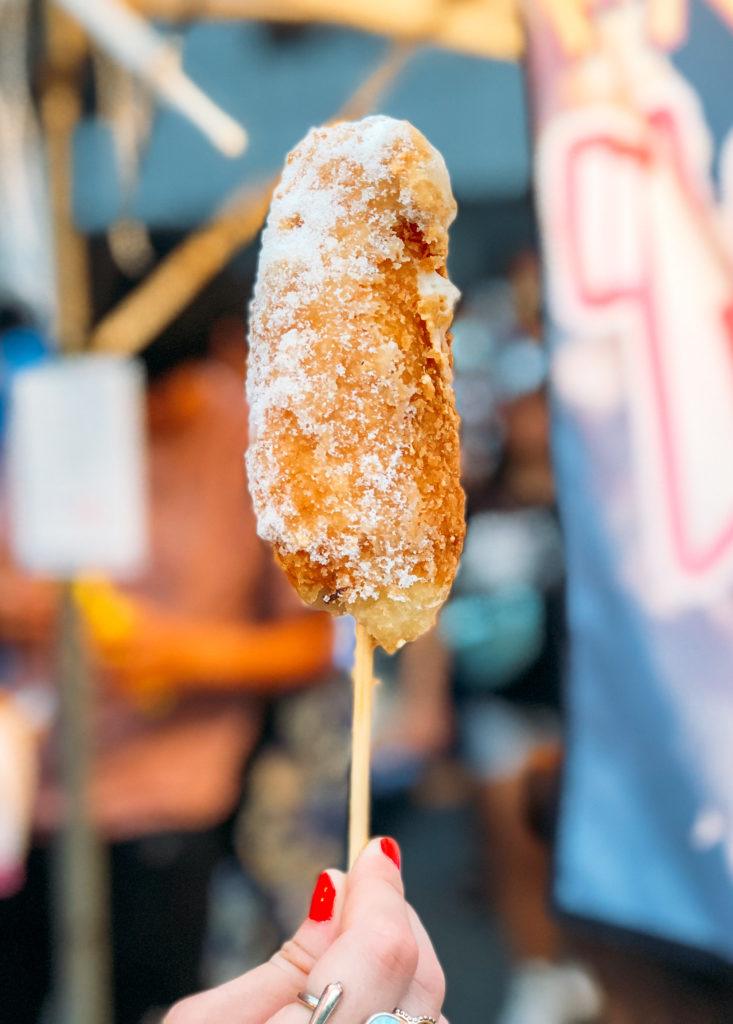 Corn dog from a street food stand at a summer festival in Japan