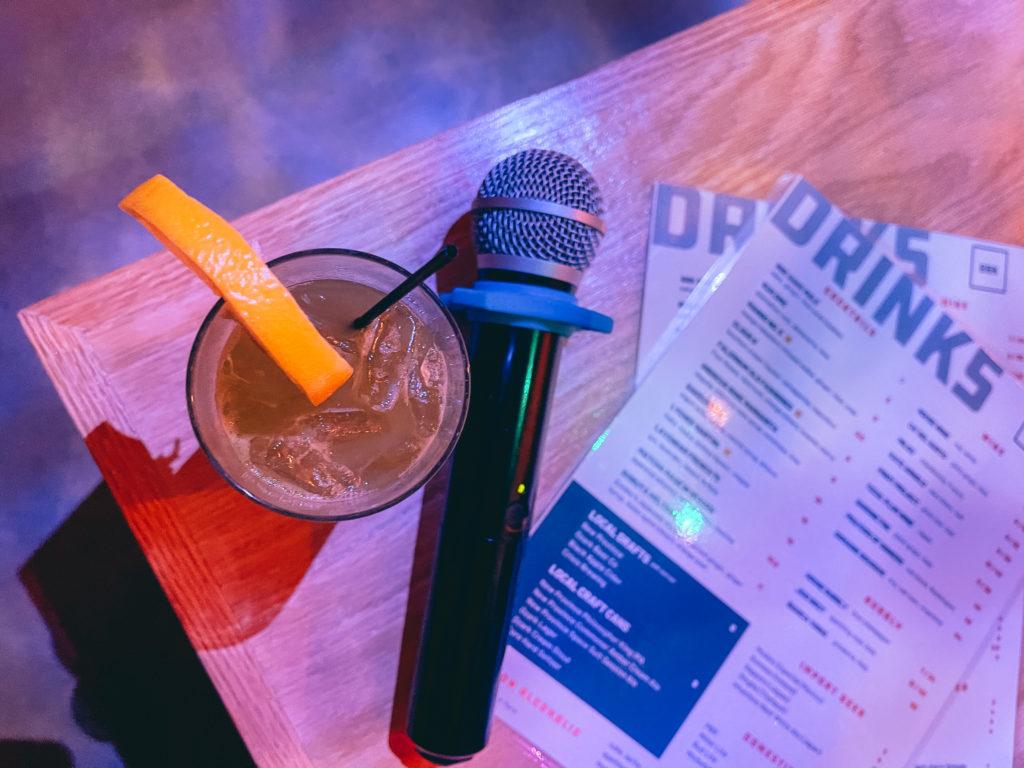 Cocktail, microphone and menu at Big Box Karaoke in Fayetteville, Arkansas