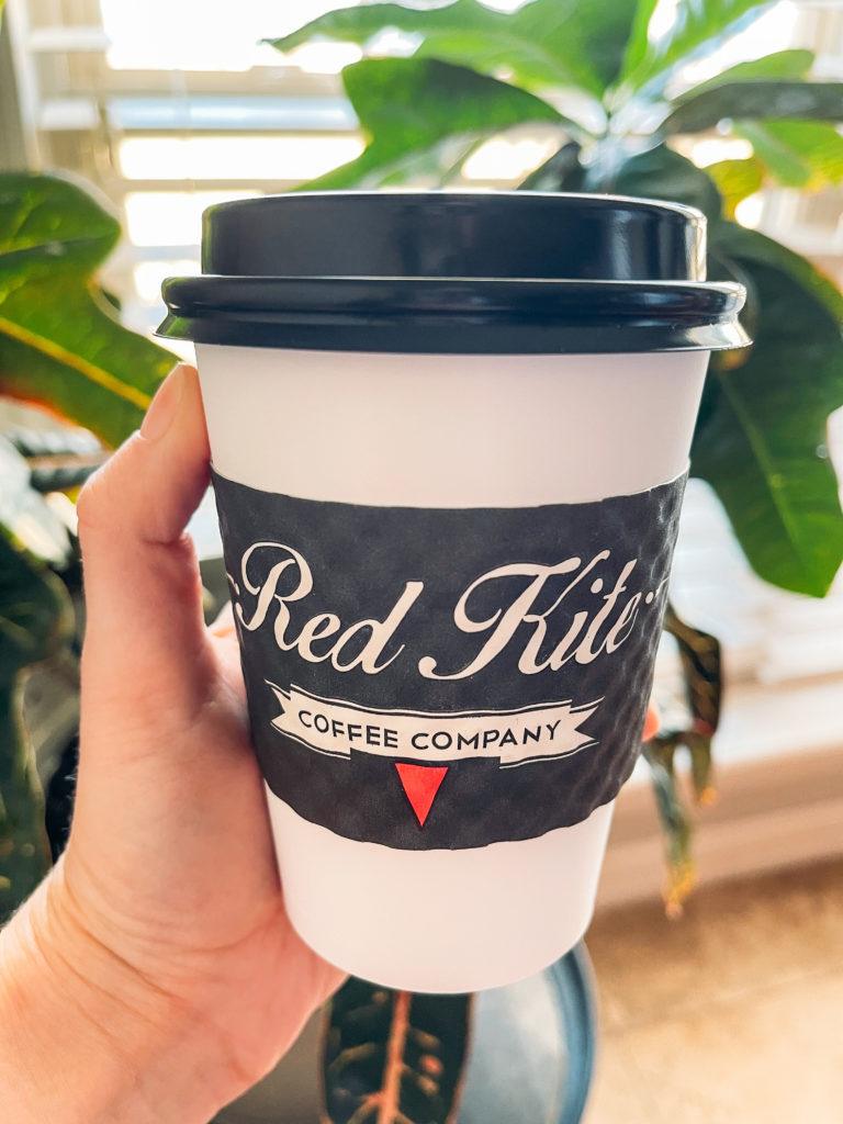 White and black coffee to-go coffee cup from Red Kite Coffee Company in Springdale, Arkansas