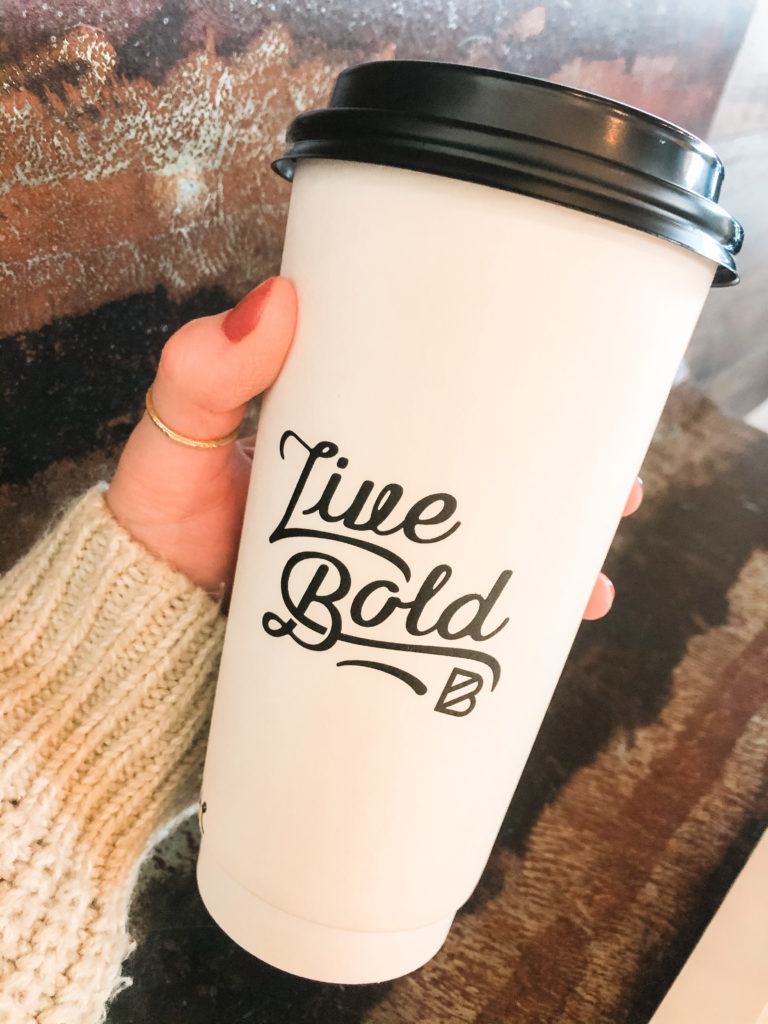 to-go coffee cup that says "live bold" from Bolder Coffee shop in Northwest Arkansas