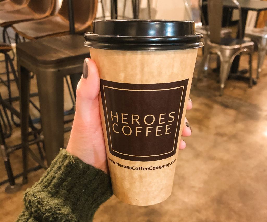 to-go coffee cup from Heroes Coffee in Bentonville, Arkansas