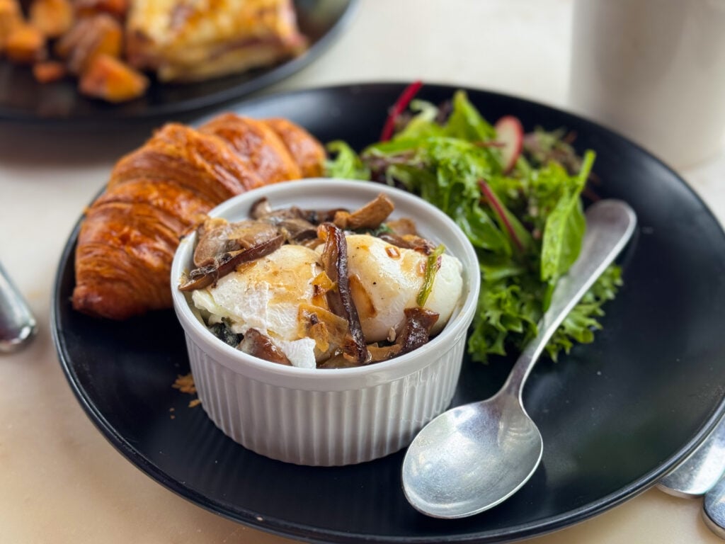 Oeuf Cocotte - a dish of poached eggs, mushrooms, and spinach from Blvd Cafe in Sarasota, Florida