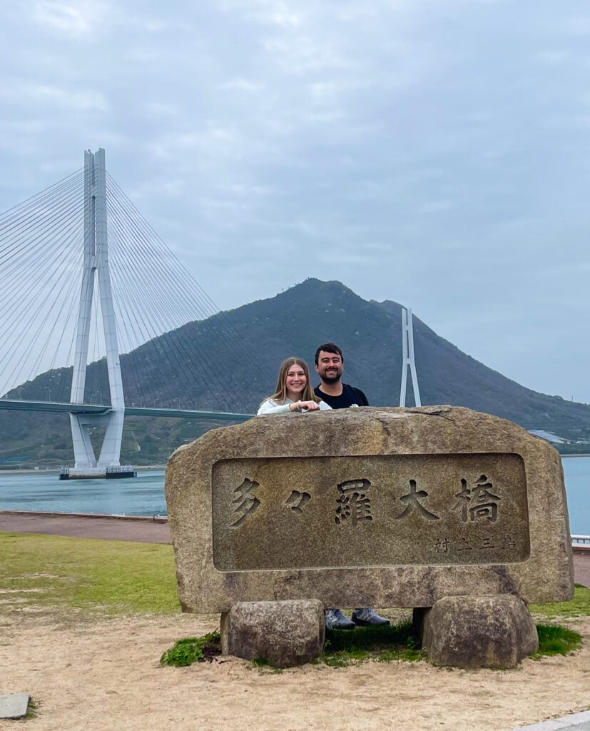 Shimanami Kaido Cyclist Sanctuary on Omishima Island with bridge view in the background.