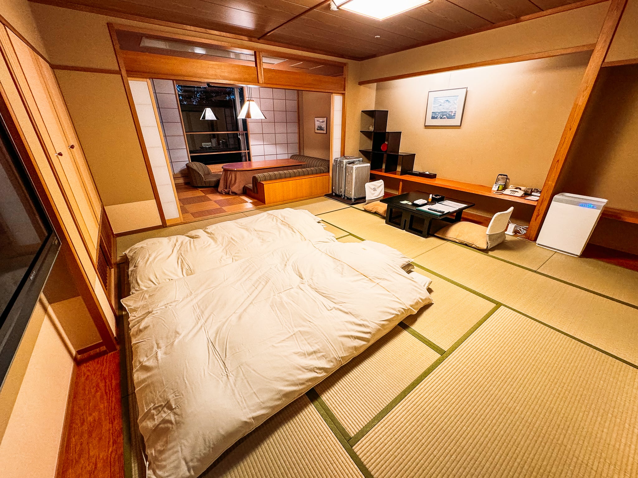 Sleeping area and living space in the Yuraku Yamabiko-tei Japanese-style room at Hotel Kaneyamaen in Fuji five lakes area.