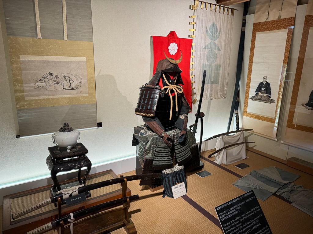 Historic Samurai outfit alongside samurai swords inside Aoyagi samurai homes in Kakunodate, Japan
