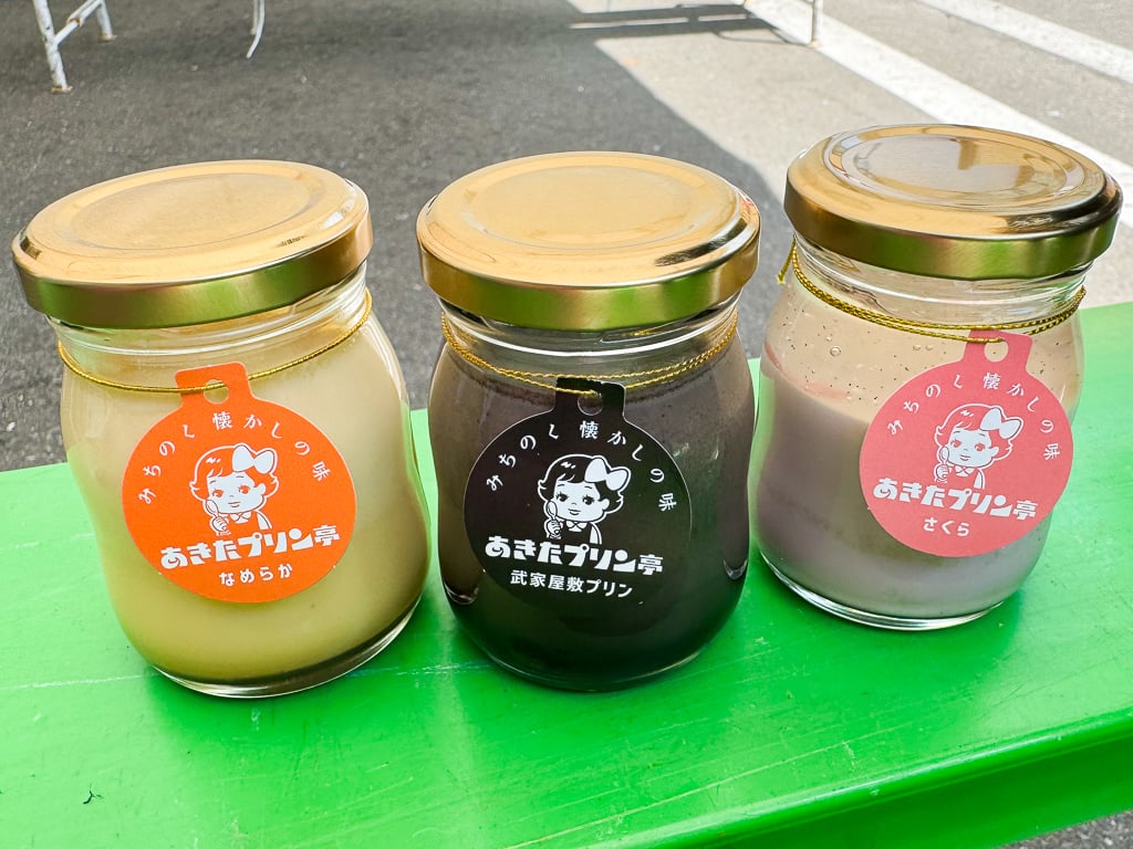 Three kinds of purin (pudding) from Michinoku Akita Pudding Shop in Kakunodate, Japan. From left to right is the classic purin, samurai residence purin made with black sesame, and a seasonal sakura purin.