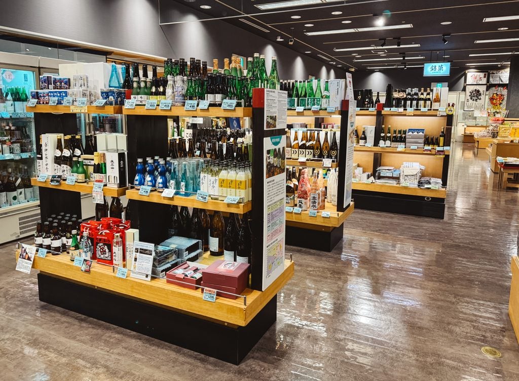 Various bottles of sake and other prefectural goods at Akitano, a store that specializes items found in Akita, Japan.