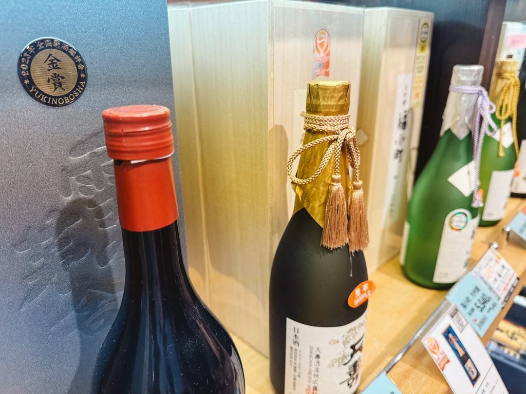 Various types of sake at Akitano, a prefectural goods store in Akita, Japan